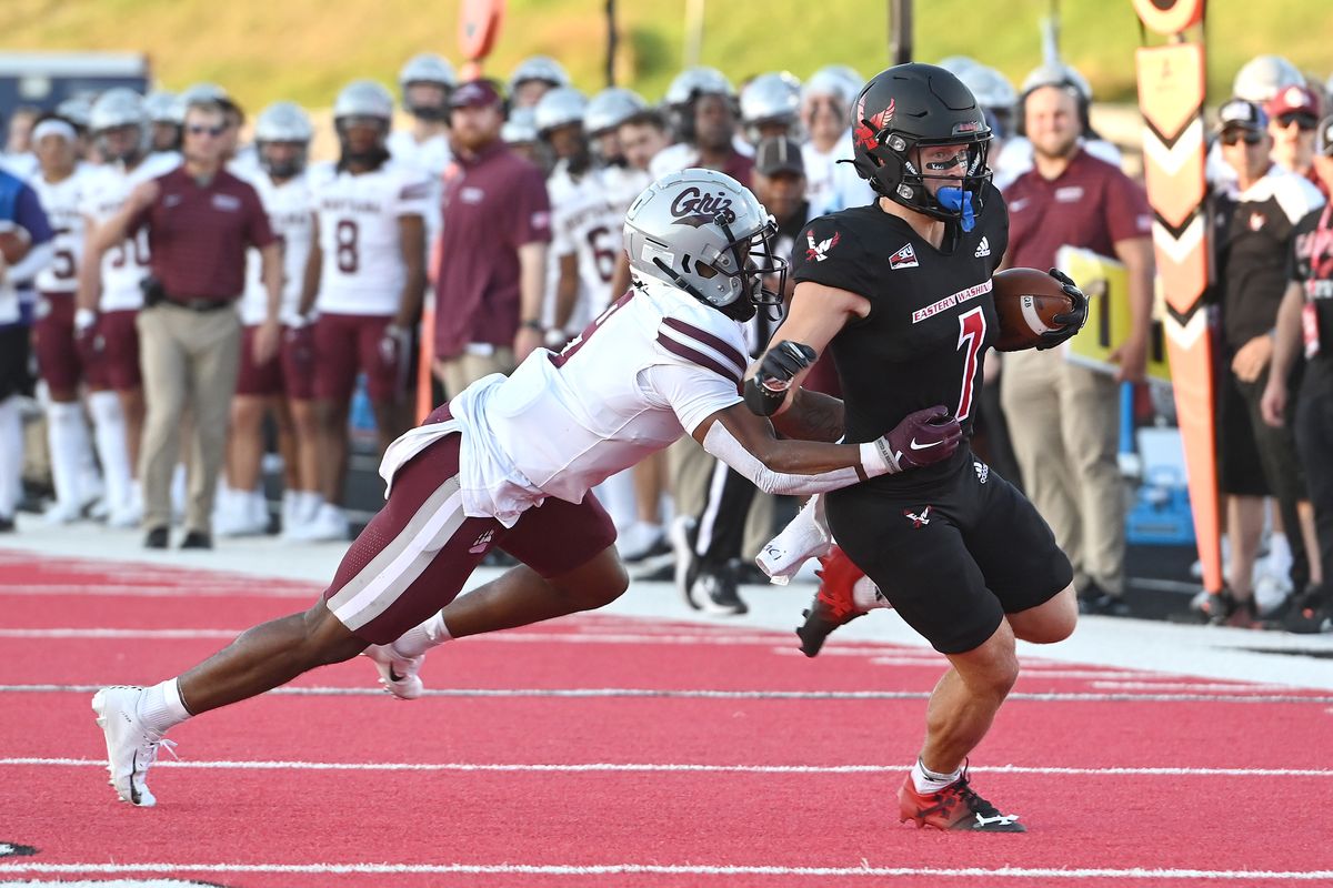 Eastern Washington receiver Efton Chism III (7), who finished with three touchdown catches, is caught from behind by Montana safety Chrishawn Gordon (9) during the first half of the Grizzlies