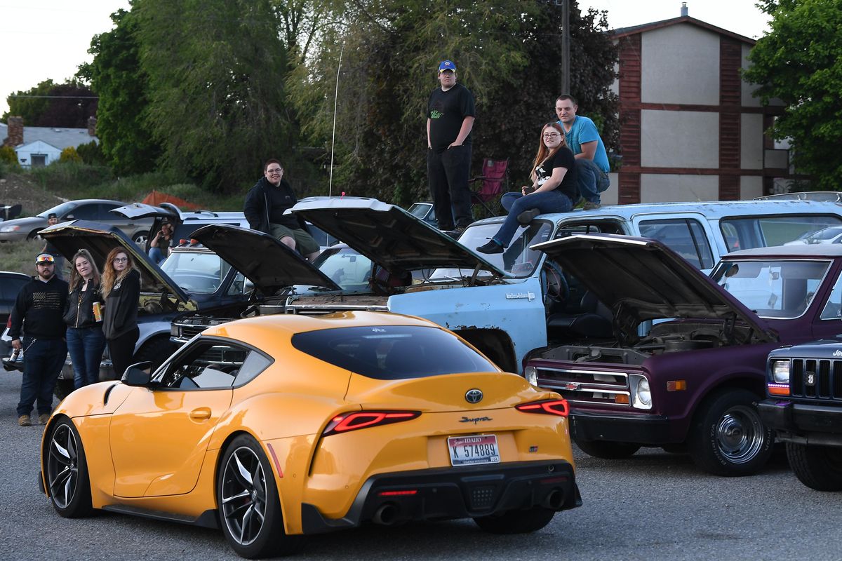 A late model Toyota Supra catches the eyes of the American-made four-wheel-drive crowd during a meet up that drew gearheads of all passions and interests on Friday, May 15, 2020, at Sprague and Pines in Spokane Valley. (Tyler Tjomsland / The Spokesman-Review)