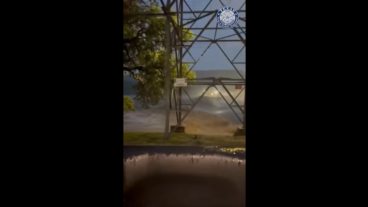 At least six people have died in catastrophic flooding in Central Texas, where the Guadalupe River rose 22 feet overnight near Hunt, according to officials.  (Screenshot from video Texas Game Wardens)