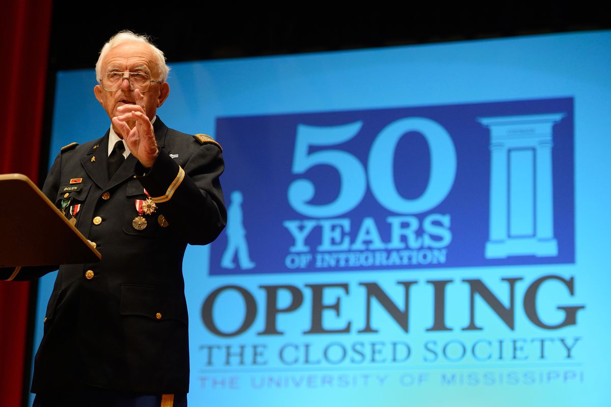 In this photo provided by the University of Mississippi, Col. Chuck Bolen, speaks at the University of Mississippi�s 50-Years of Integration remembrance Sunday evening, Sept. 30, 2012 at the University�s Gertrude Ford Center for the Performing Arts. Bolen, who led the troops that occupied Oxford, Miss., during James Meredith�s integration to Ole Miss was to speak at a �Walk of Reconciliation and Redemption�, but all of the evening�s events were moved indoors due to the rain. (Robert Jordan / University Of Mississippi)