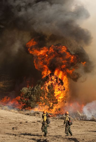 Crews use a controlled burn  in Wrightwood, Calif., on Sunday. (Associated Press / The Spokesman-Review)