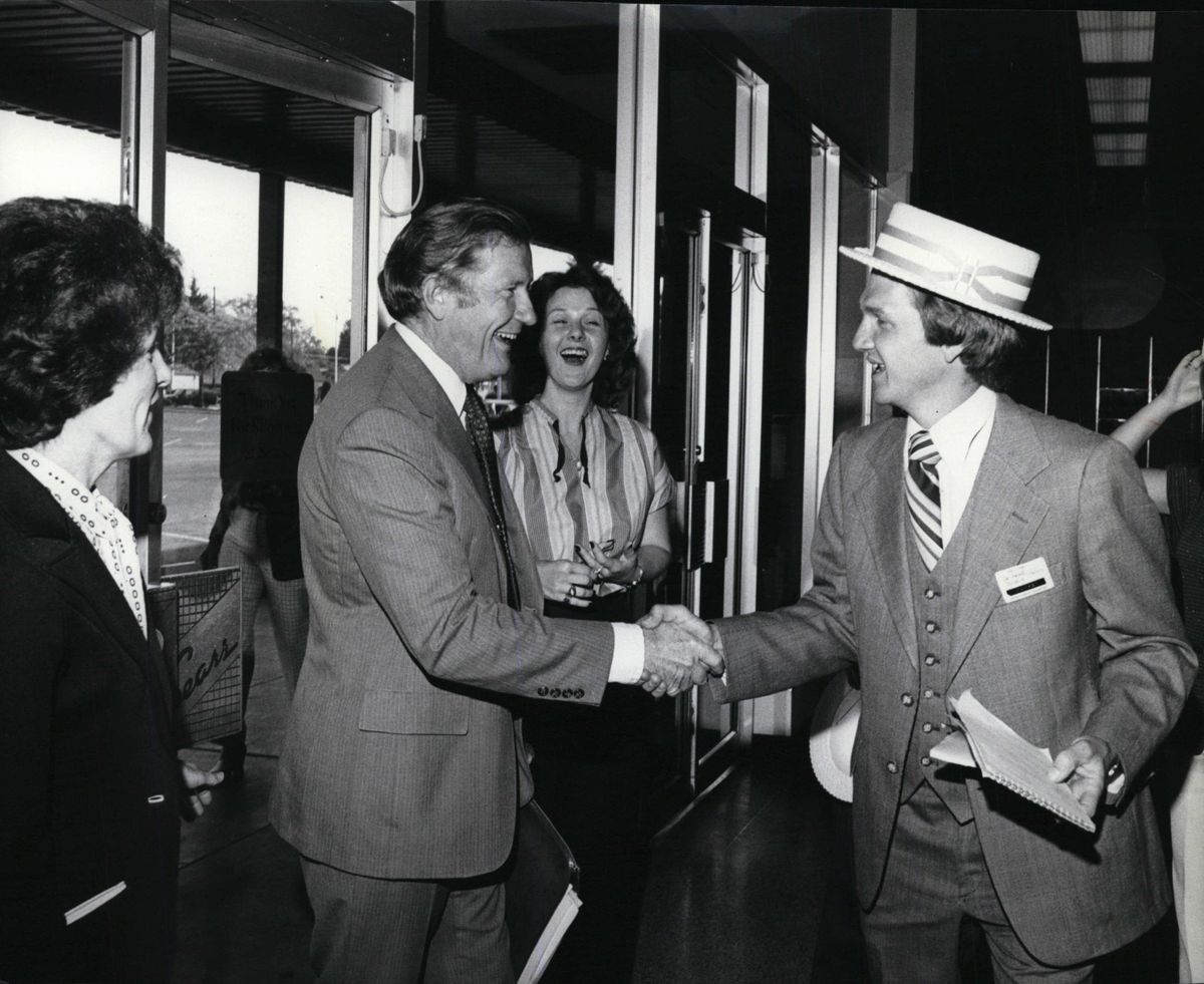 John Sonneland shaking hands with Warren Olson of Sears in 1980. (The Spokesman-Review / PHOTO ARCHIVE)