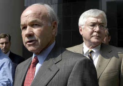 
Enron founder Kenneth Lay, left, and his attorney Mike Ramsey  leave the federal courthouse in Houston last summer. 
 (File/Associated Press / The Spokesman-Review)
