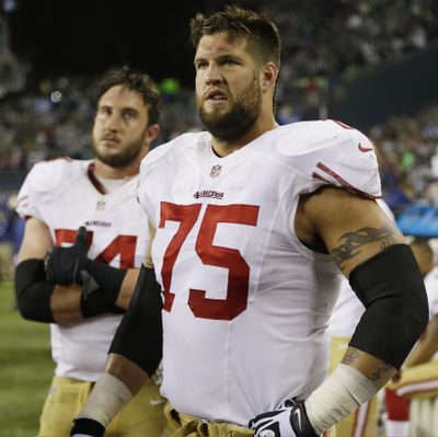 San Francisco 49ers' Alex Boone (75) and Joe Staley watch the field after the NFL football NFC Championship game against the Seattle Seahawks, Sunday, Jan. 19, 2014, in Seattle. The Seahawks won 23-17 to advance to Super Bowl XLVIII. (Marcio Jose Sanchez / Associated Press)