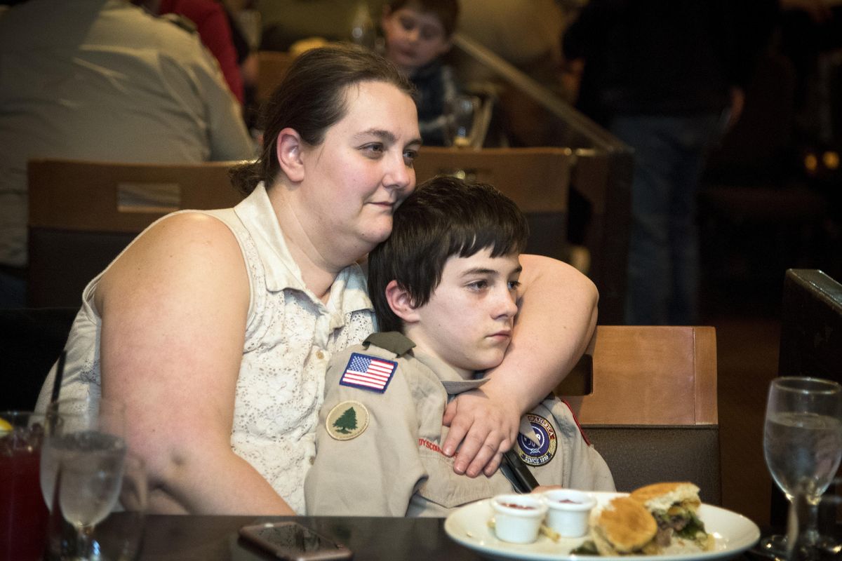Felicia Boyle and her son Dylan Boyle, 12, take in an episode of the Fox reality TV show “Kicking and Screaming” during a watch party at the Max Lounge at the Mirabeau Park Hotel, Thursday, April 134, 2017. (Colin Mulvany / The Spokesman-Review)
