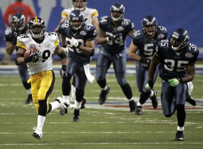 
Willie Parker takes off on a 75-yard touchdown run as he's chased by a handful of Seahawks. The Seattle defense gave up several big plays that proved costly.
 (Associated Press / The Spokesman-Review)
