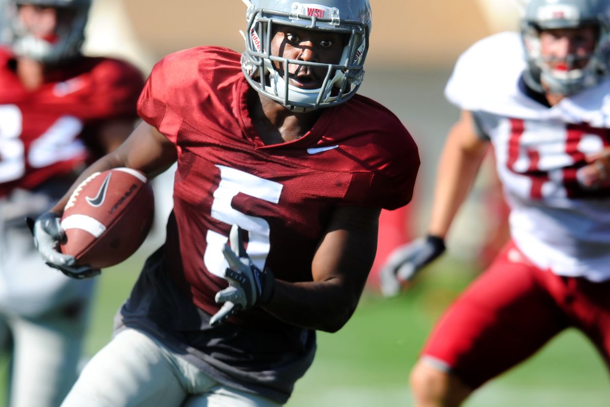 Rickey Galvin runs the ball during WSU’s practice on Tuesday. (Tyler Tjomsland)