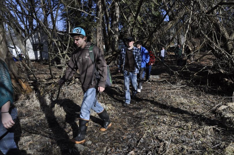 Colville Valley high school students hike through the 19 acres of woods surrounding the Colville Fish Hatchery, purchased by Stevens County to be used for science studies. (Rich Landers)
