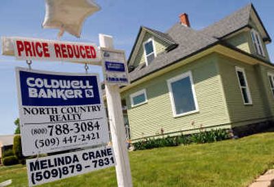 
This house in north-central  Spokane sold for $61,000 in December. After  getting new floors, paint  and vinyl windows,  it's now listed for  sale at $139,900.  
 (Rajah Bose / The Spokesman-Review)