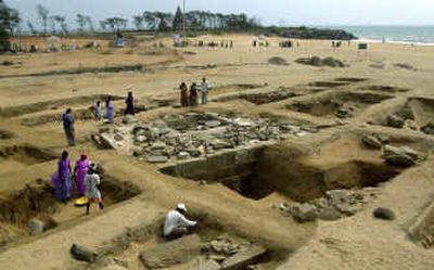 
 Officials of Archaeological Survey of India and laborers work at an excavation site in Mahabalipuram, India, last Sunday. Mahabalipuram, once the capital of an ancient kingdom and a place long famed for its elaborate Hindu temples, escaped the Dec. 26 tsunami mostly unscathed, at least by comparison. Excavations on shore and at sea were already under way before the tsunami struck. 
 (File/Associated Press / The Spokesman-Review)