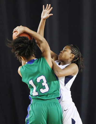 G-Prep’s Otiona Gildon defends against Woodinville’s Ali Forde. (PATRICK HAGERTY)