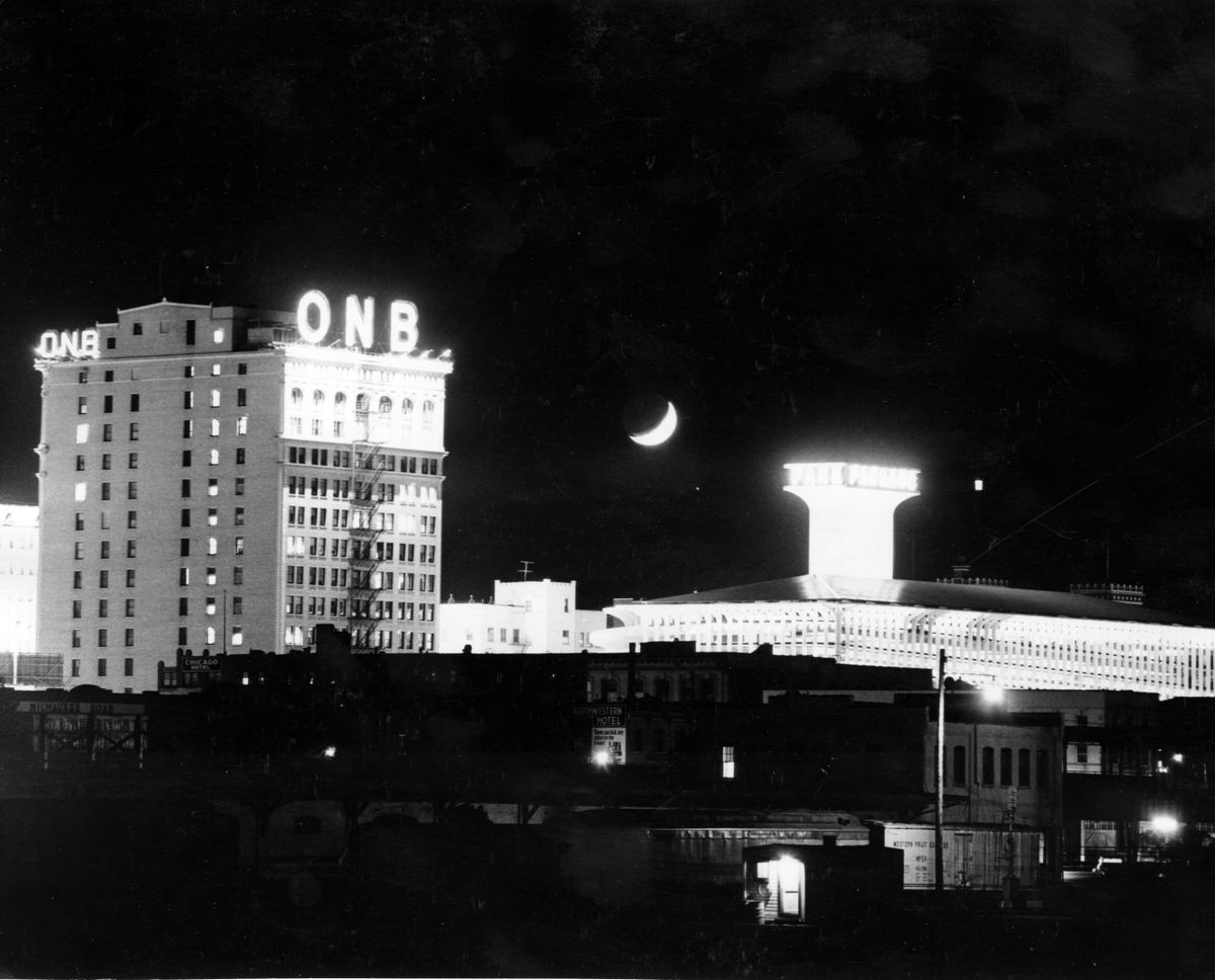 The Parkade and the upper floor of the Old National Bank Building cast a bright radiance over downtown Spokane on a frosty December night in 1967.  (The Spokesman-Review photo archive)