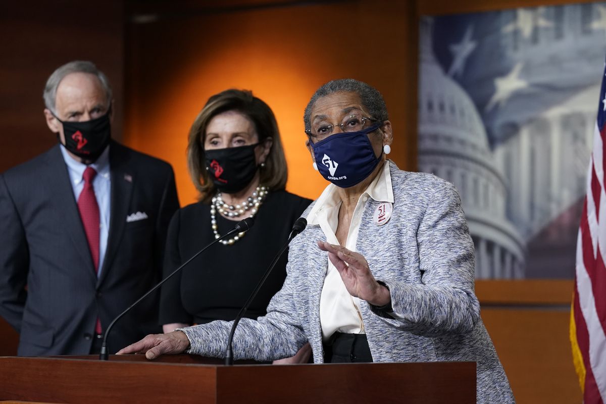 In this April 21, 2021, photo, Del. Eleanor Holmes-Norton, D-D.C., center, joined from left by Sen. Tom Carper, D-Del., and House Speaker Nancy Pelosi, D-Calif., speaks at a news conference ahead of the House vote on H.R. 51- the Washington, D.C. Admission Act, on Capitol Hill in Washington  (J. Scott Applewhite)