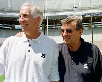In this Aug. 6, 1999, file photo, Penn State football coach Joe Paterno, right, poses with his defensive coordinator Jerry Sandusky during the college football team’s media day in State College, Pa. (Paul Vathis / Associated Press)