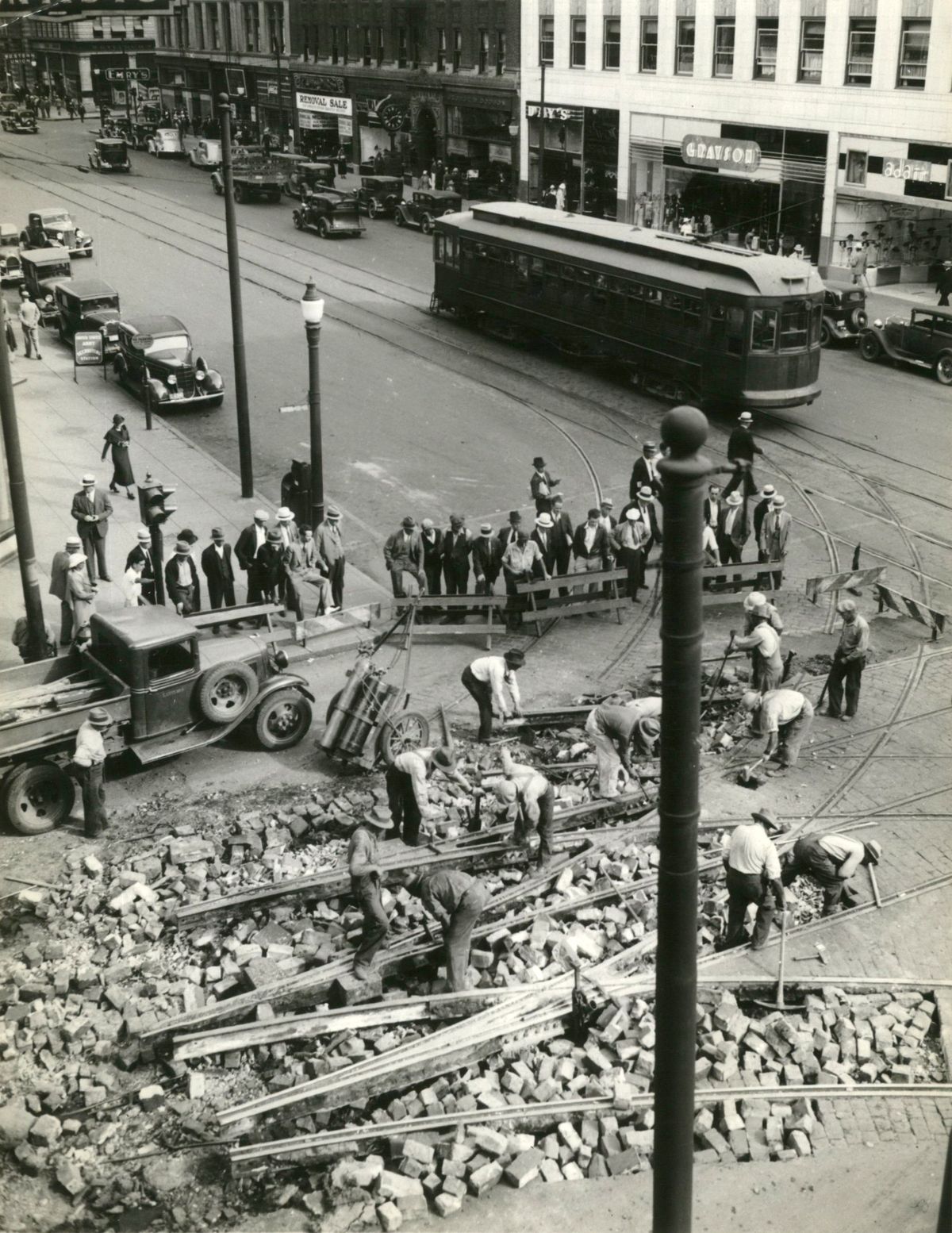 1935: A crew of about 40 men work to remove the streetcar tracks at Riverside Avenue and Howard Street. The Spokane United Railways service, owned and operated by Washington Water Power, was preparing to discontinue all but a few of its trolley routes. This picture, taken from the Exchange Building, shows the crew at work and, in the background, a streetcar moving east on Riverside, making one of its last trips.  (SPOKESMAN-REVIEW PHOTO ARCHIVES)