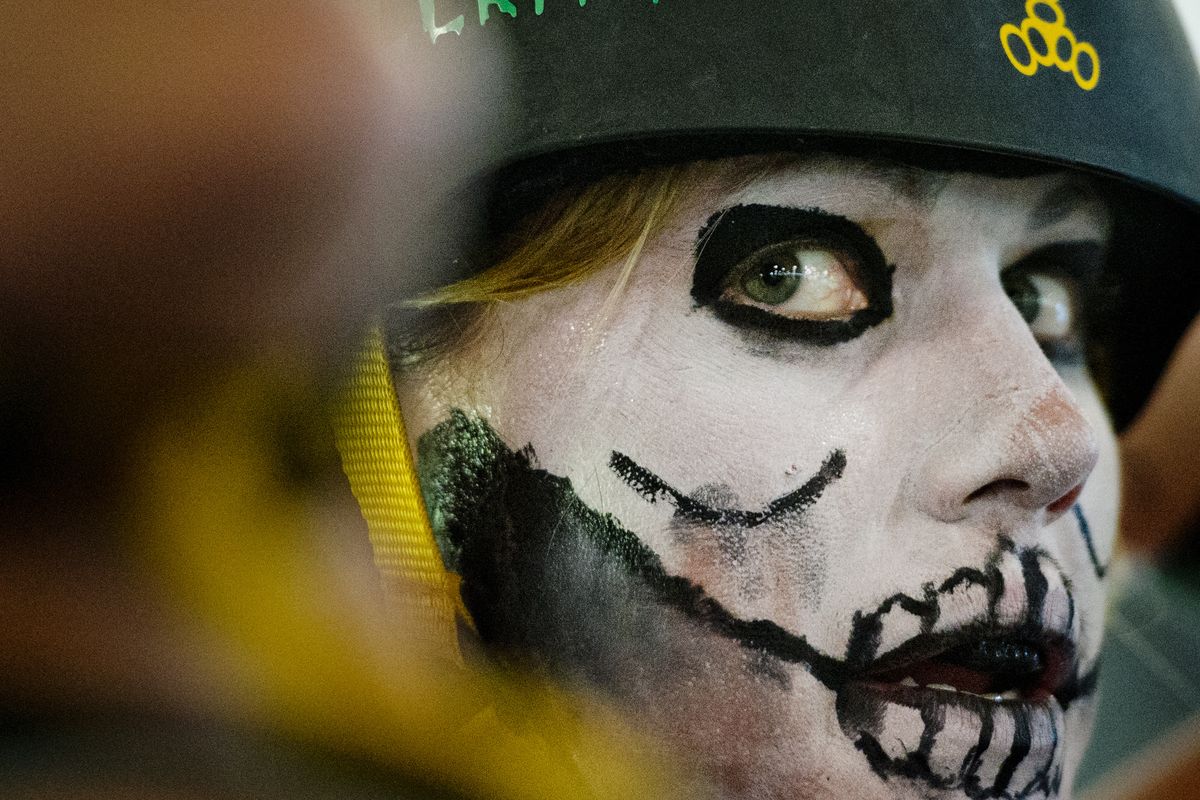 Venomous Vixen Kristie Blair, who goes by Hooky Hellraiser, watches her roller-derby teammates compete in a bout against the Ellensburg Rodeo City Rollergirls on Saturday, July 21, at the Kootenai County Fairgrounds in Coeur d’Alene.