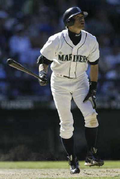 
Ichiro Suzuki watches this hit fly, fly away in the 11th inning.
 (Associated Press / The Spokesman-Review)