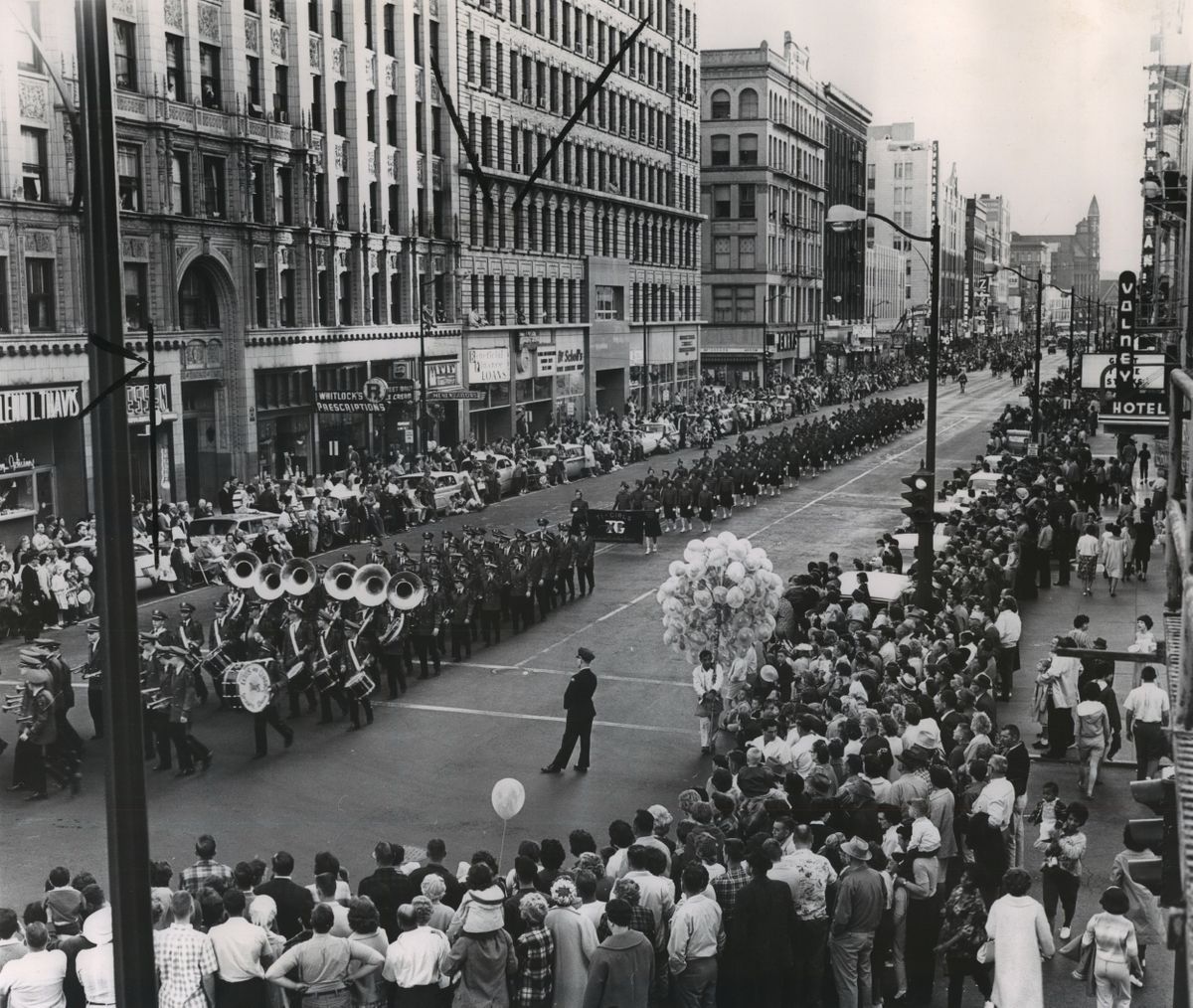 1963: Crowds spill into the street as a brass band marches down Riverside Avenue at the Lilac Festival Parade, an annual event since May 1938. Because of the proximity of the festival and Armed Forces Day, the two have been interwoven since 1950. The combination of the Lilac Festival Parade and the Armed Forces Day Parade  (Spokesman-Review Photo Archives)