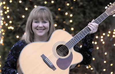 Spokane Valley Singer/songwriter Cheryl Branz, guitar in hand, has just released a Christmas CD of traditional songs, including one song that she wrote. “I did not start playing the guitar until 7 years ago,” she said.  (J. BART RAYNIAK / The Spokesman-Review)