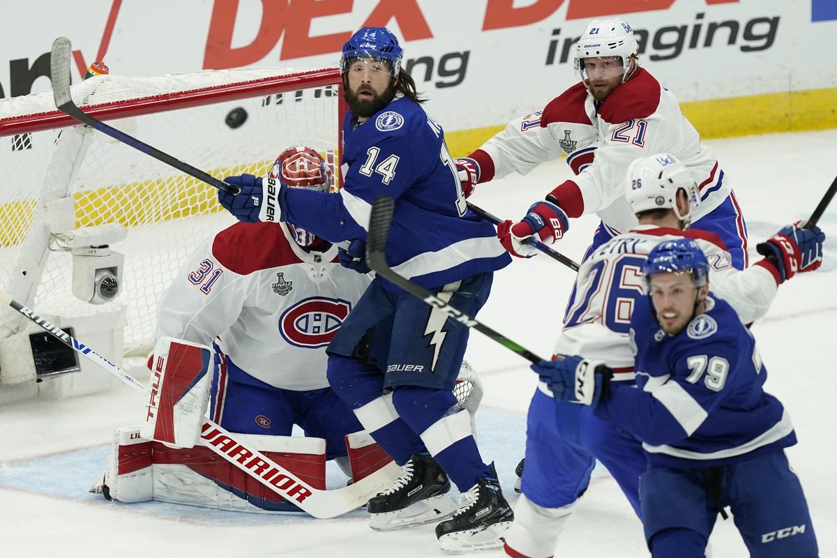 Tampa Bay Lightning left wing Pat Maroon (14) screens Montreal Canadiens goaltender Carey Price (31) during the first period in Game 1 of the NHL hockey Stanley Cup finals, Monday, June 28, 2021, in Tampa, Fla.  (Gerry Broome)