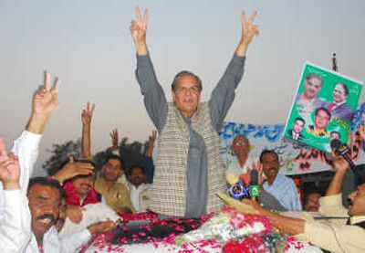 
Javed Hashmi, leader of Pakistan's ousted Prime Minister Nawaz Sharif's Muslim League party, flashes victory signs after his release from a jail in Multan, Pakistan, on Thursday. Associated Press
 (Associated Press / The Spokesman-Review)