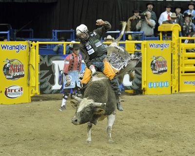 Shane Proctor of Grand Coulee rides Squirrel Grove to his second victory in two nights at the NFR. (BOB CLICK)