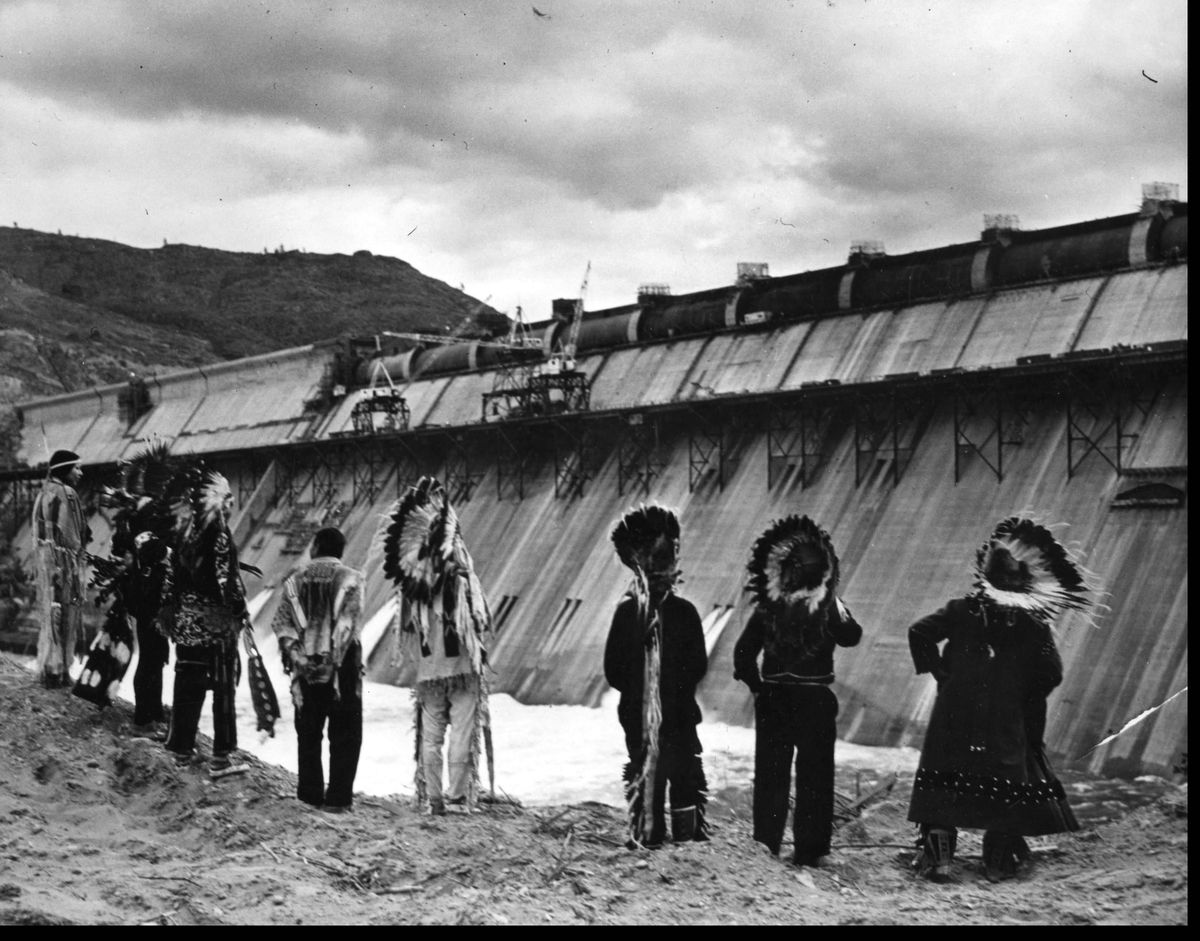 Traditional chiefs of the Colville Indian Reservation gathered at the not-yet finished Grand Coulee Dam in this 1941 photo by William S. Russell for the Bureau of Reclamation. (U.S. Bureau of Reclamation)