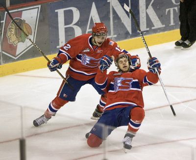 Spokane Chiefs center Brady Brassart, right,  celebrates with Marek Kalus after scoring in the first period against the Portland Winterhawks in Game 1 of the WHL Western Conference playoff series in Portland.  (Doug Beghtel / The Oregonian)