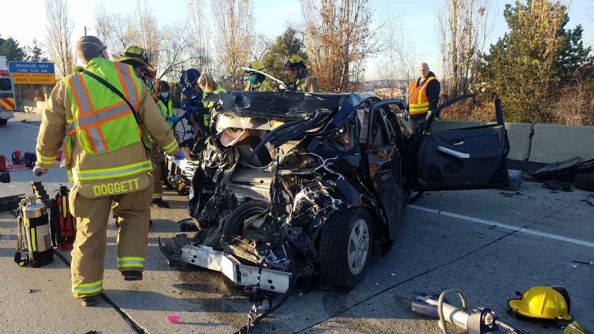 The Spokane Valley Fire Department responded to a high-speed crash involving a car and a semitruck on westbound Interstate 90 just west of Pines Road on Nov. 8, 2021. Crews extricated the driver from the heavily damaged car. The driver was taken to a local hospital for treatment.  (Courtesy, SVFD Facebook)