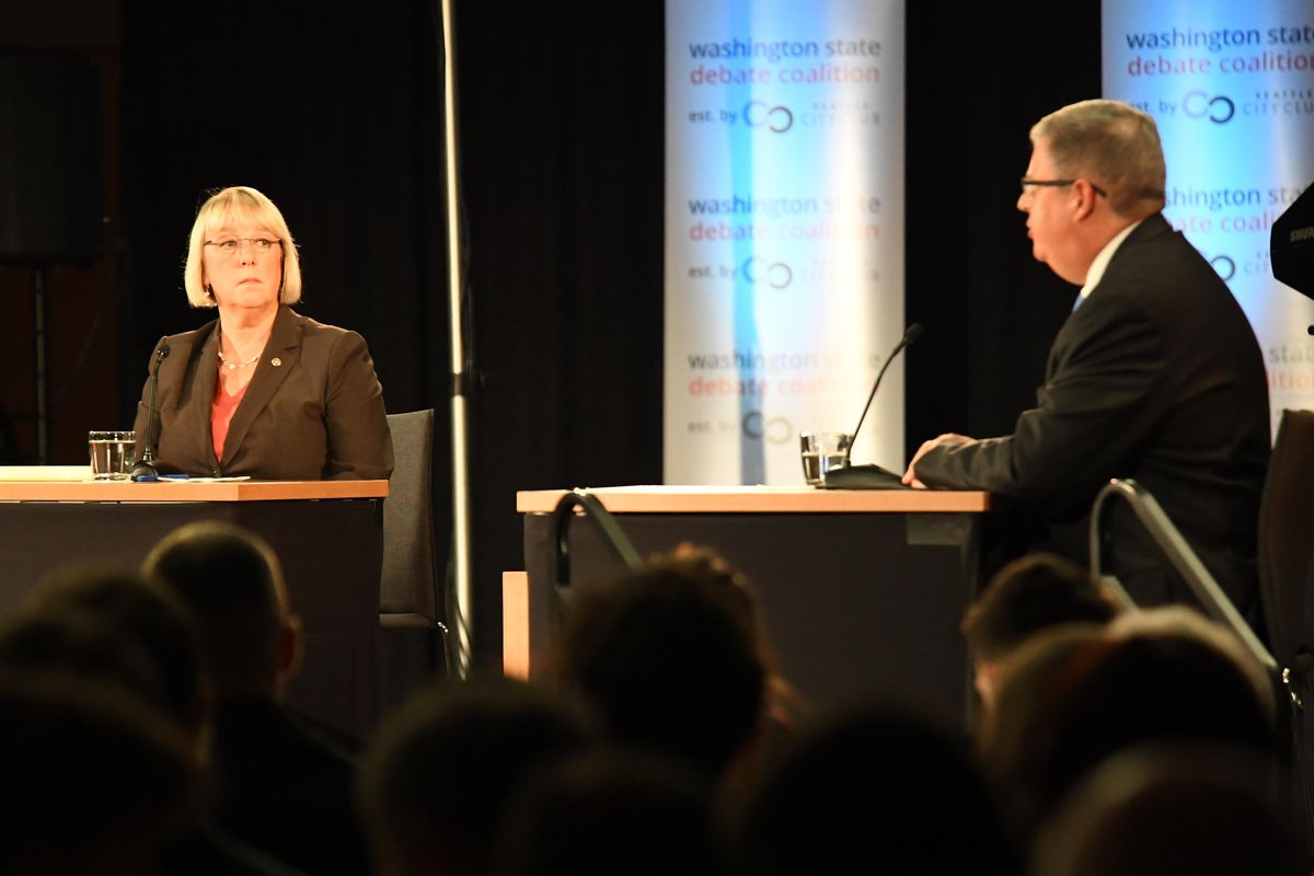 Senator Patty Murray, left, listens to challenger Chris Vance, right, make a point during their debate Sunday, Oct. 16, 2016 at Gonzaga University. (Jesse Tinsley / The Spokesman-Review)