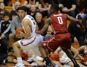 Washington State's Ike Iroegbu, right, defends against Oregon State's Malcolm Duvivier on Thursday. (AP)