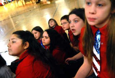 
Skyway Elementary students watch the lighting of the Friendship Flame on Friday during the 23rd annual Human Rights Celebration at North Idaho College. 
 (Brian Plonka / The Spokesman-Review)