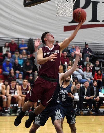 Whitworth guard Ben College (4) shoots an under-handed layup during the second half of a college basketball game, Mon., Dec. 16, 2019, at Whitworth University. (Colin Mulvany / The Spokesman-Review)