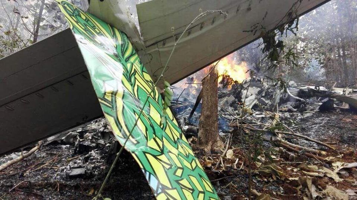 This photo released by Costa Rica’s Civil Aviation press office shows the site of a plane crash in Punta Islita, Guanacaste, Costa Rica, Sunday, Dec. 31, 2017. A government statement says there were 10 foreigners and two Costa Rican crew members aboard the plane belonging to Nature Air, which had taken off nearby. (Associated Press)