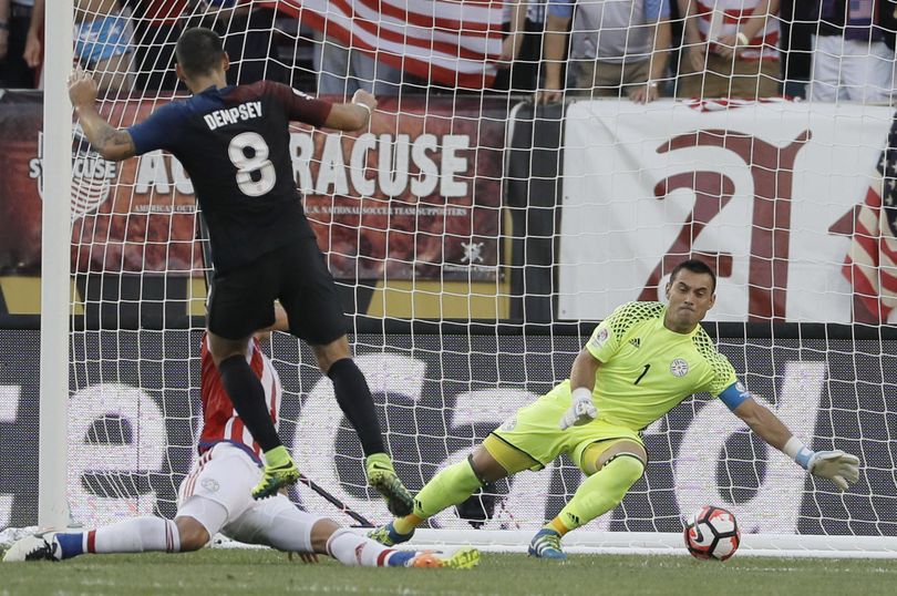 United States’ Clint Dempsey scores a goal past Paraguay’s Justo Villar, right, and Fabian Balbuena during the first half of a Copa America Group A soccer match Saturday in Philadelphia. (Matt Slocum / Associated Press)