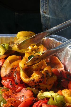 Roasted sweet bell peppers at the Spokane Farmers Market on Sept. 12. Jeanette Herman of Cliffside Orchards is roasting peppers at the market. (Lorie Hutson)