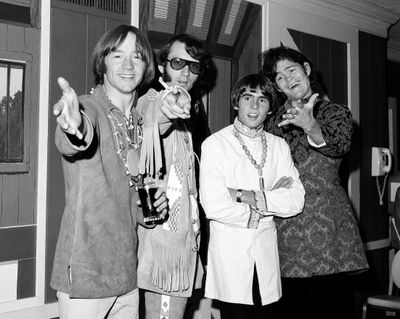 This July 6, 1967 file photo shows, from left, Peter Tork, Mike Nesmith, David Jones and Micky Dolenz of the musical group The Monkees at a news conference at the Warwick Hotel in New York. Tork, who rocketed to teen idol fame in 1965 playing the lovably clueless bass guitarist in the made-for-television rock band The Monkees, died Thursday, Feb. 21, 2019, of complications related to cancer, according to his son Ivan Iannoli. He was 77. (Ray Howard / AP)