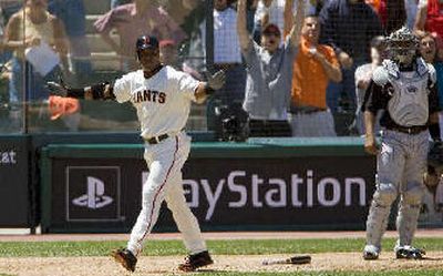 
San Francisco slugger Barry Bonds starts his 715th home run trot Sunday. 
 (Associated Press / The Spokesman-Review)