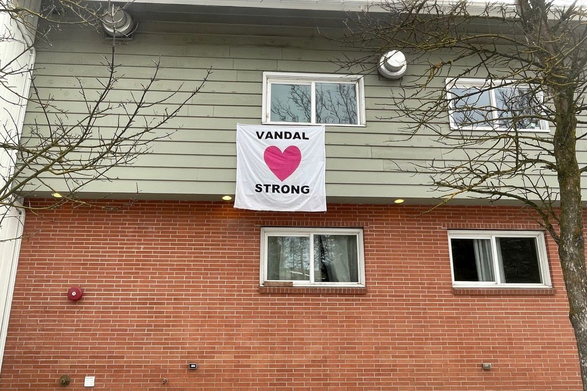 A “Vandal Strong” sign hangs outside the University of Idaho Alpha Gamma Rho fraternity Saturday in Moscow.  (Garrett Cabeza / The Spokesman-Review)