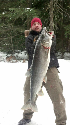  Micah Smith caught this huge mackinaw while ice fishing at Priest Lake on March 1, 2014. (Tyler Smith)