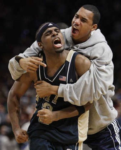 
Pitt's Levance Fields celebrates with a teammate after hitting the winning shot to beat Duke. Associated Press
 (Associated Press / The Spokesman-Review)