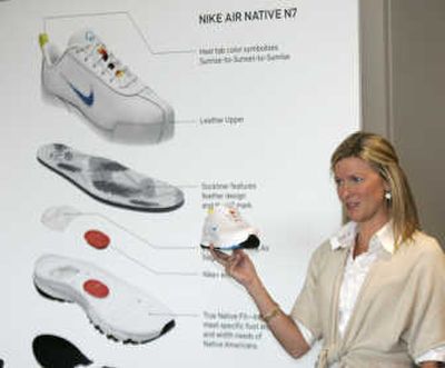
Nike product line manager Ann Marie Fallow shows the new Nike Air Native N7 shoe at Nike headquarters in Beaverton, Ore., on Tuesday. Nike unveiled the new shoe Tuesday — a first-of-a-kind performance shoe designed to address the specific fit and width requirements of the Native American foot. Associated Press
 (Associated Press / The Spokesman-Review)