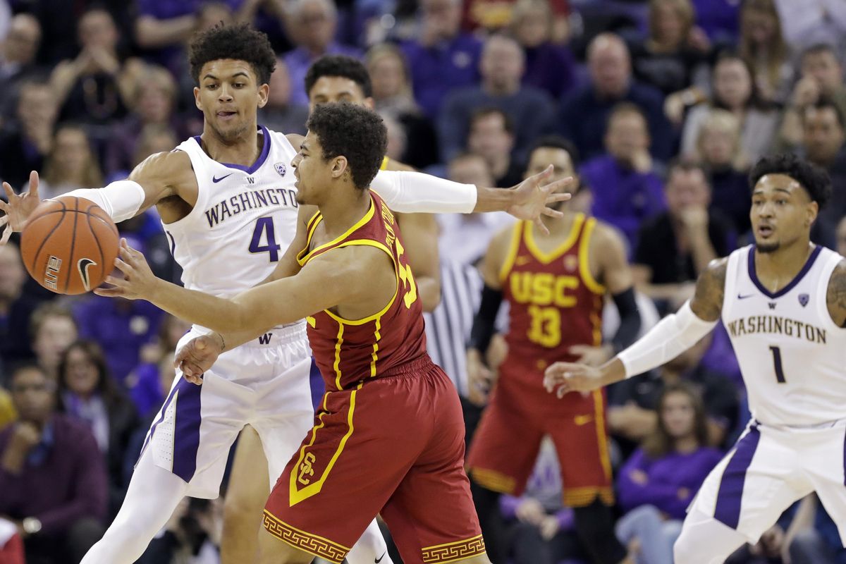 Washington’s Matisse Thybulle  defends against Southern California’s Derryck Thornton during the first half  Wednesday  in Seattle. (Elaine Thompson / AP)
