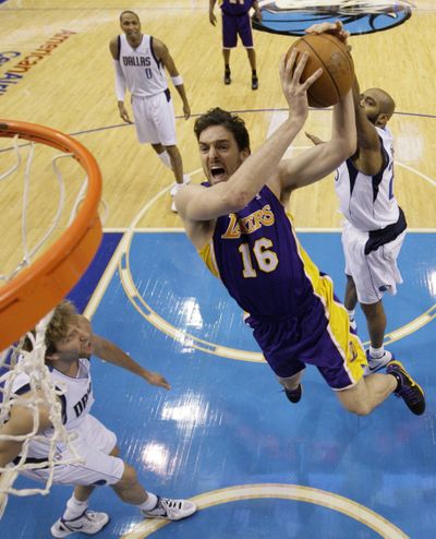 The Lakers’ Pau Gasol, who scored 24 points, drives for a basket in Los Angeles’ 96-91 win over Dallas. (Associated Press)