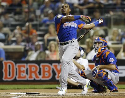 Yoenis Cespedes, of the Oakland Athletics, watches ball during the first round of the MLB All-Star baseball Home Run Derby. (Associated Press)