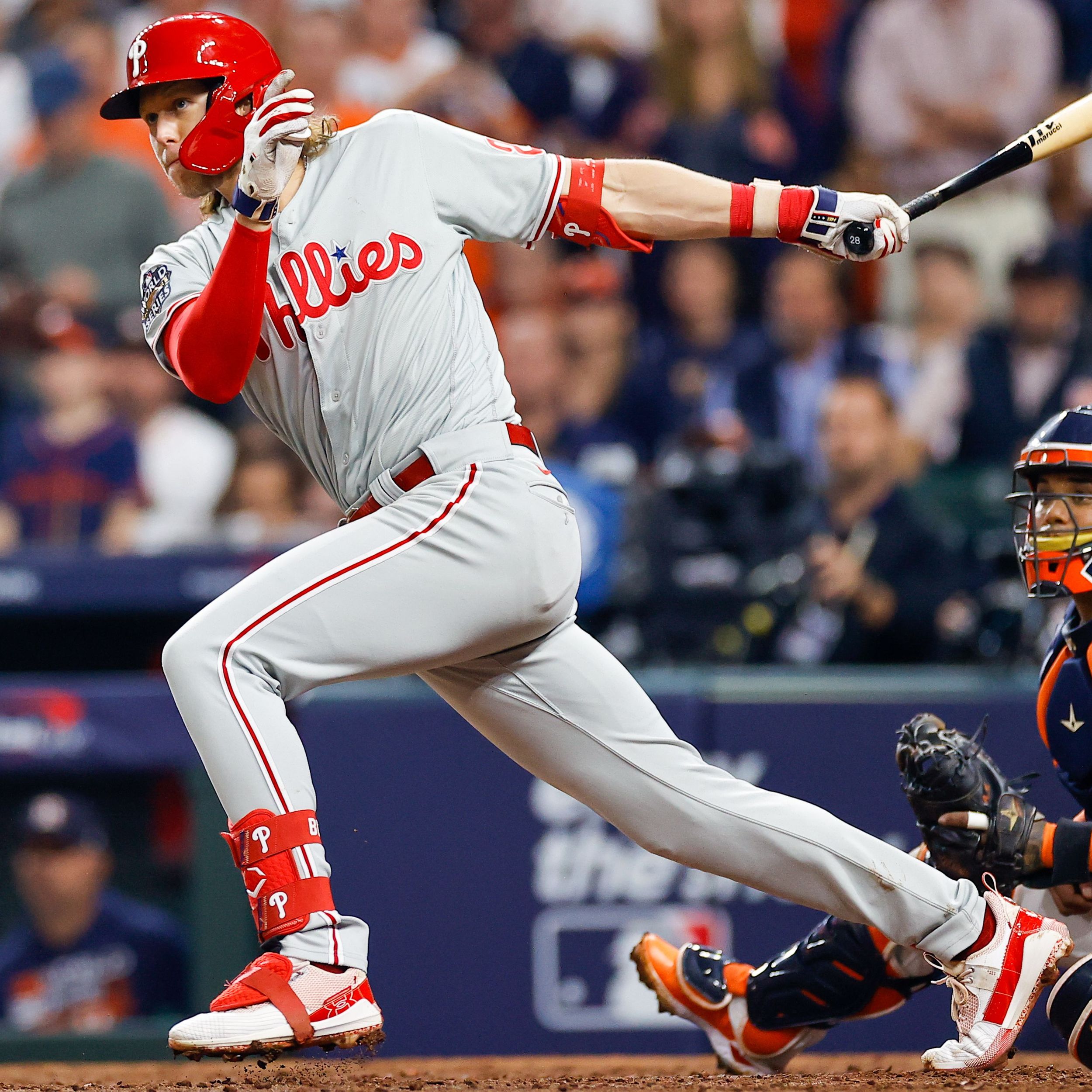 Philadelphia Phillies' Brandon Marsh smiles at Alec Bohm (28