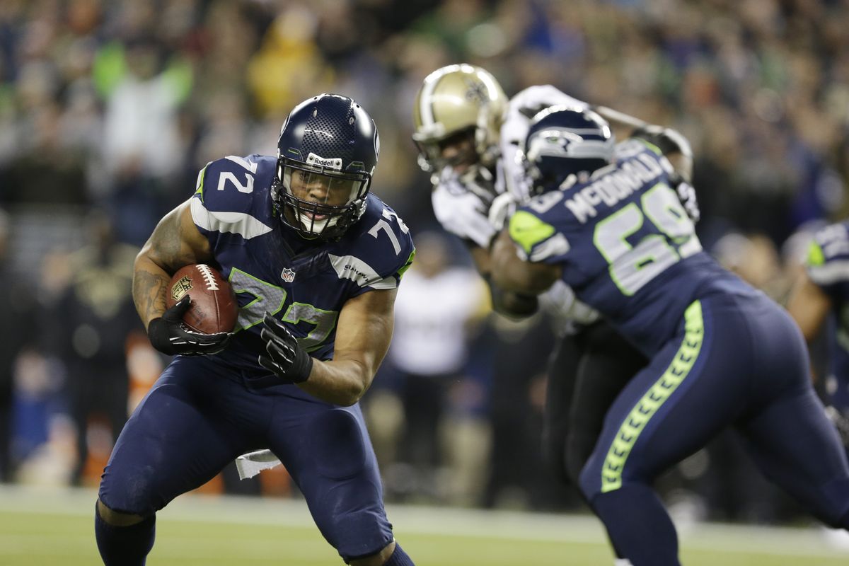 Seahawks defensive end Michael Bennett returns a fumble 22 yards for a touchdown in the first quarter to give Seattle a 10-0 lead. (Associated Press)