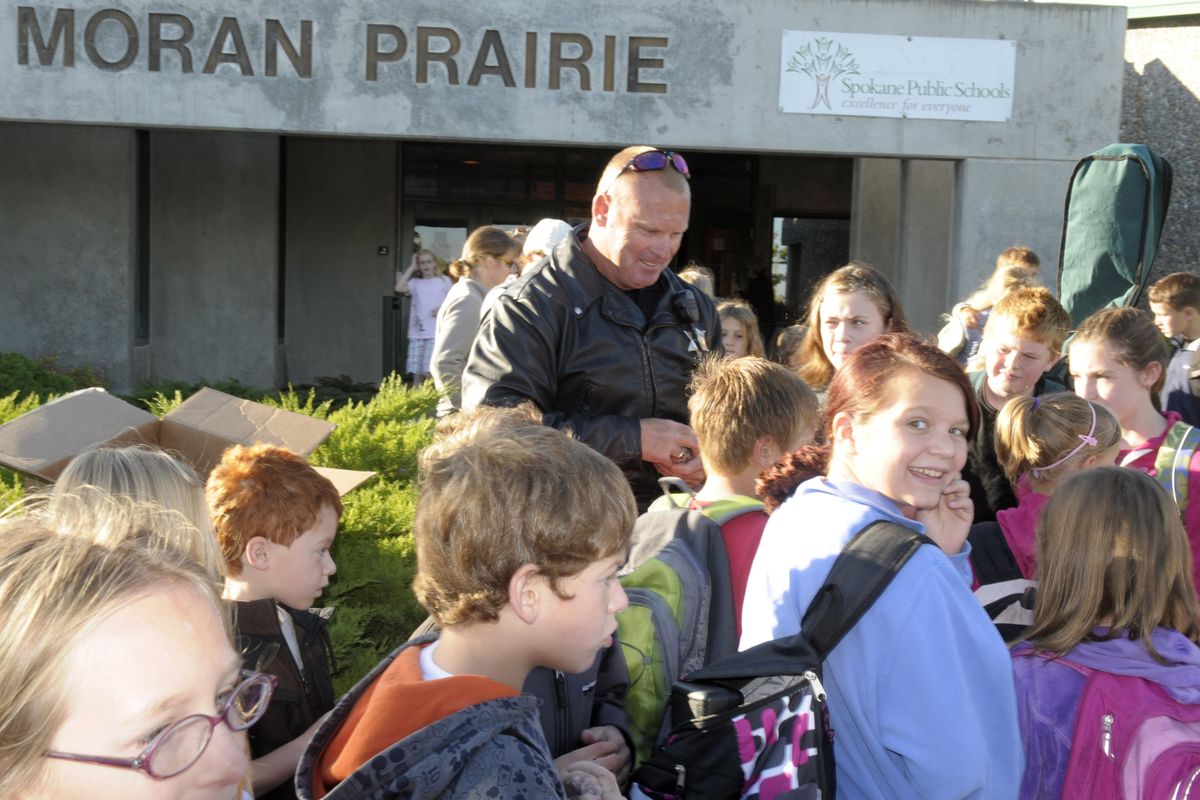 Students and parents walking to Moran Prairie Elementary were met by Spokane County sheriff