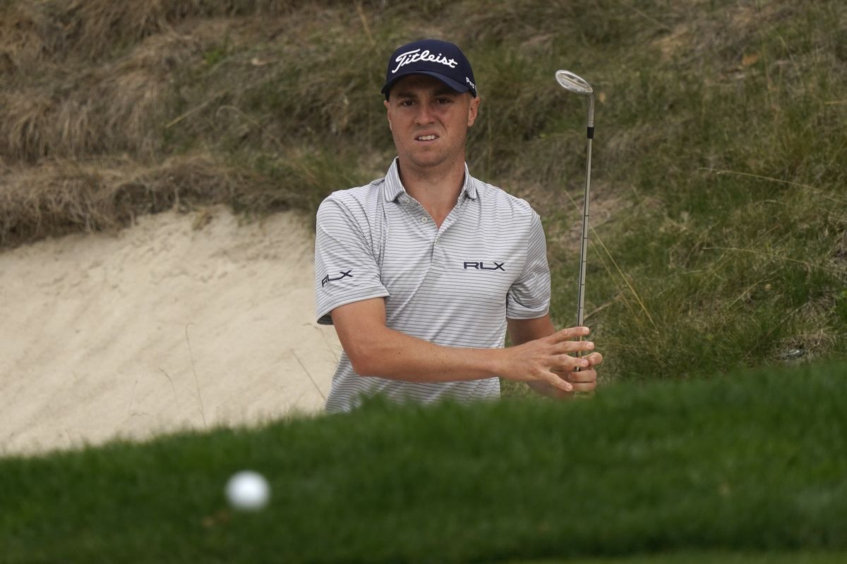Justin Thomas hits from the bunker to the eighth green during the second round of the Zozo Championship golf tournament Friday, Oct. 23, 2020, in Thousand Oaks, Calif.  (Associated Press)