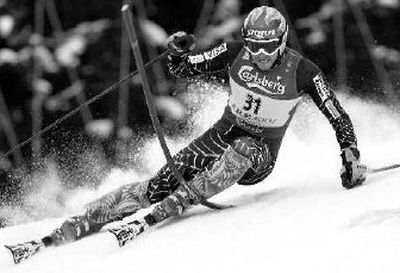 
American Bode Miller speeds past a pole during the men's slalom. 
 (Associated Press / The Spokesman-Review)